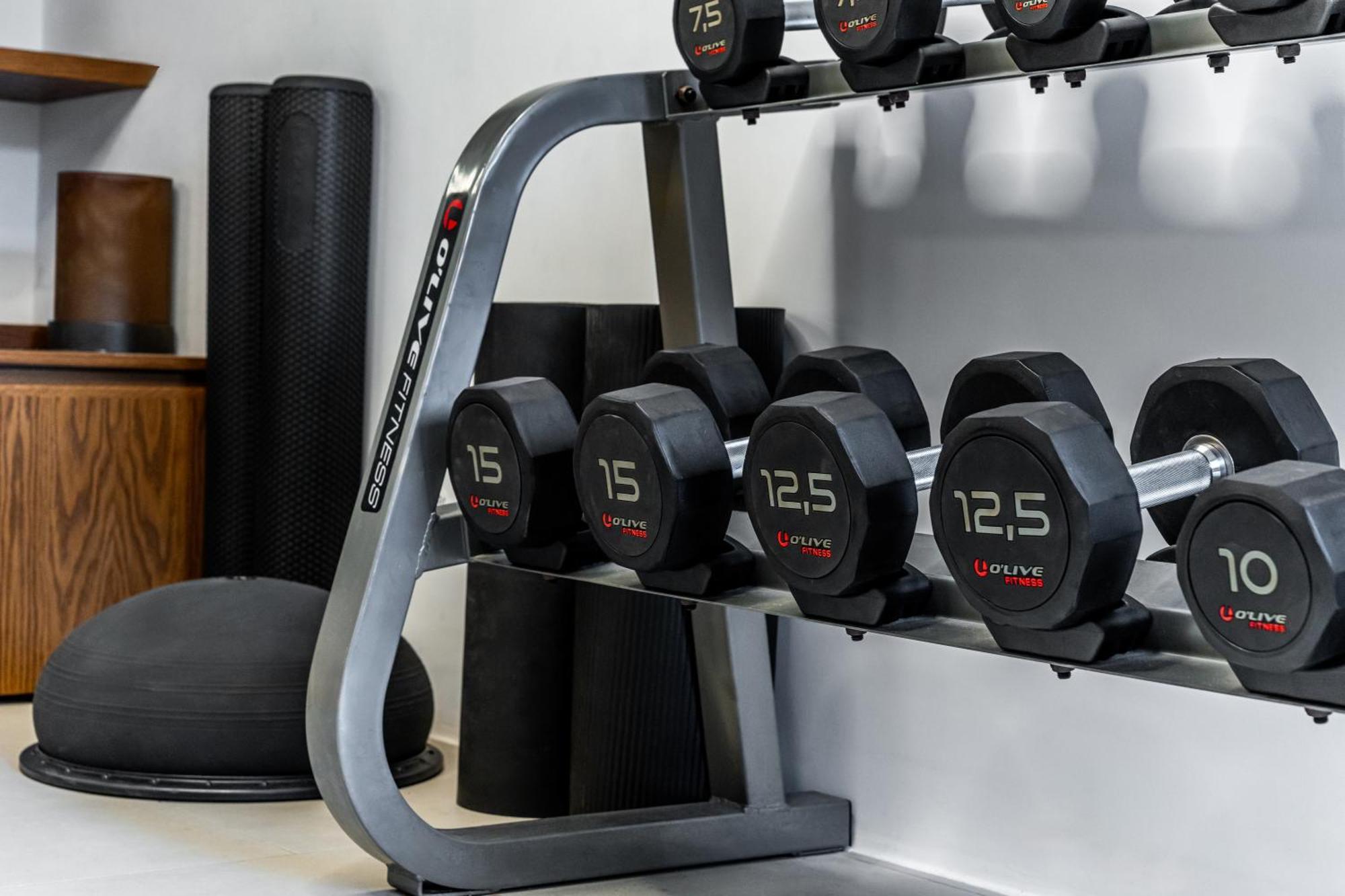 Orama Hotel & Spa Тира Экстерьер фото Dumbbell rack
